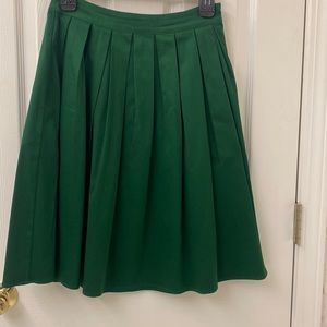 Pleated skirt with pockets. Grace Karin- size Small.